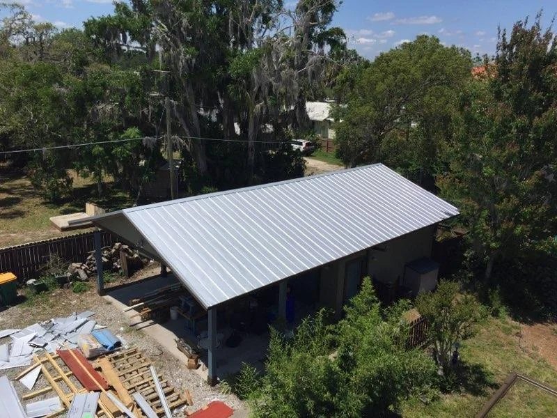 Completed roof installation with new architectural shingles in Tampa