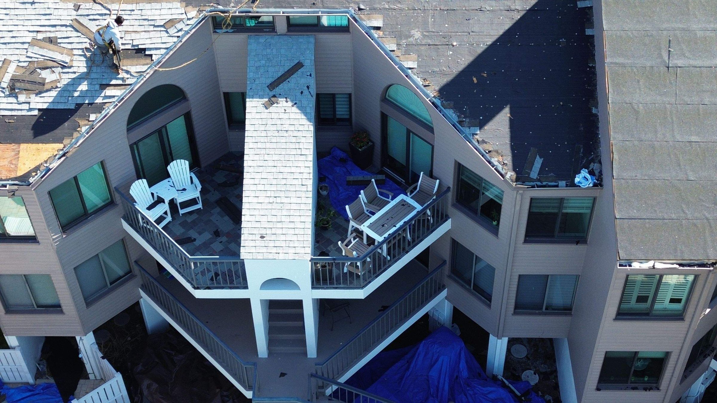 Modern Florida home with standing seam metal roof — aerial view